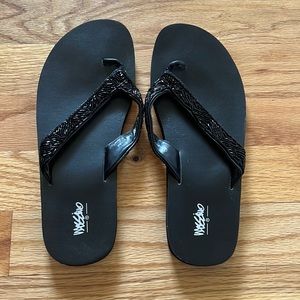 Black beaded flip flops